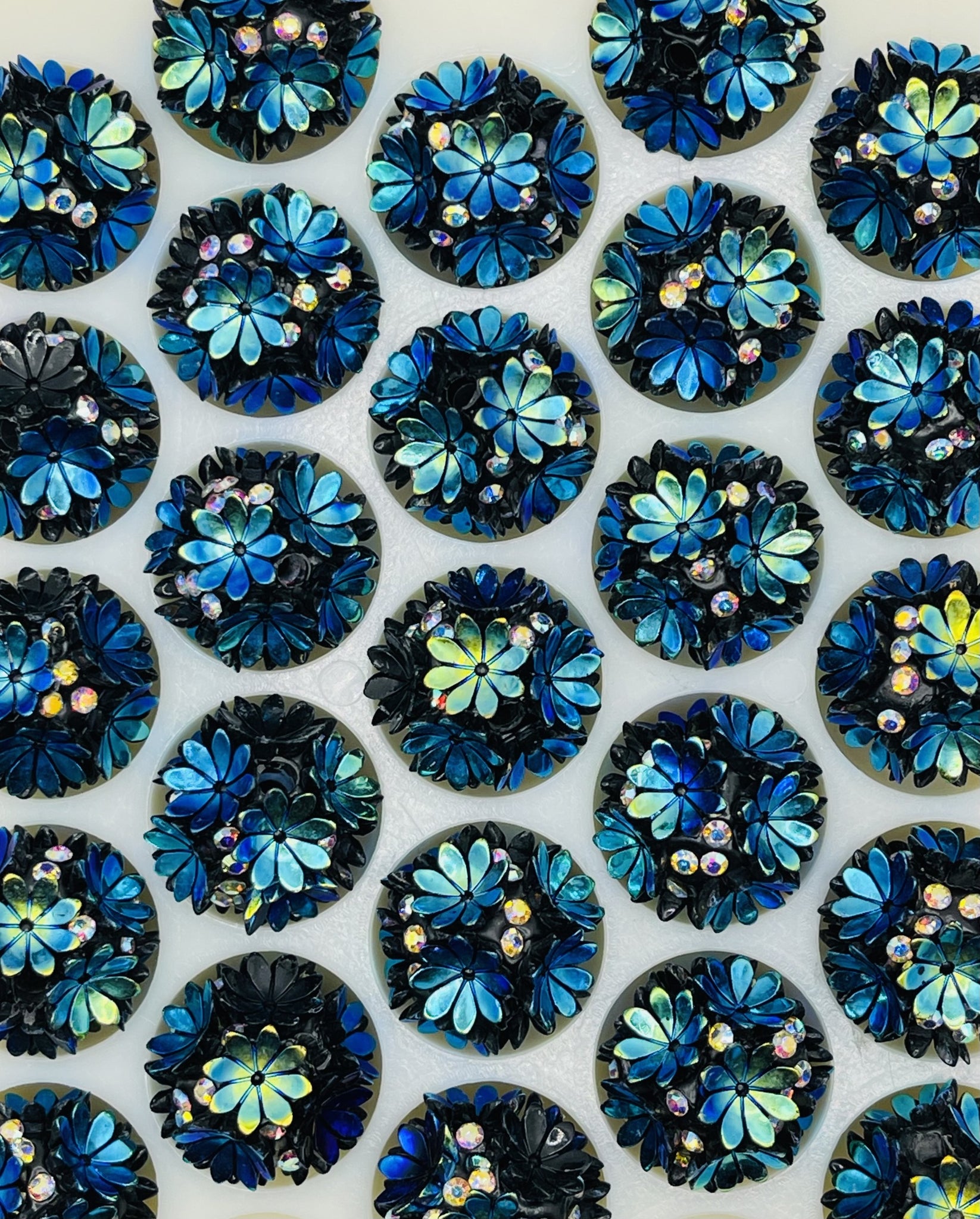 Iridescent Blue Floral Bead Collection: Black and Blue Blossoms with Crystal Accents.